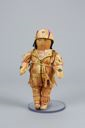 Image of Innu hunter tea doll in hide outfit decorated with beads